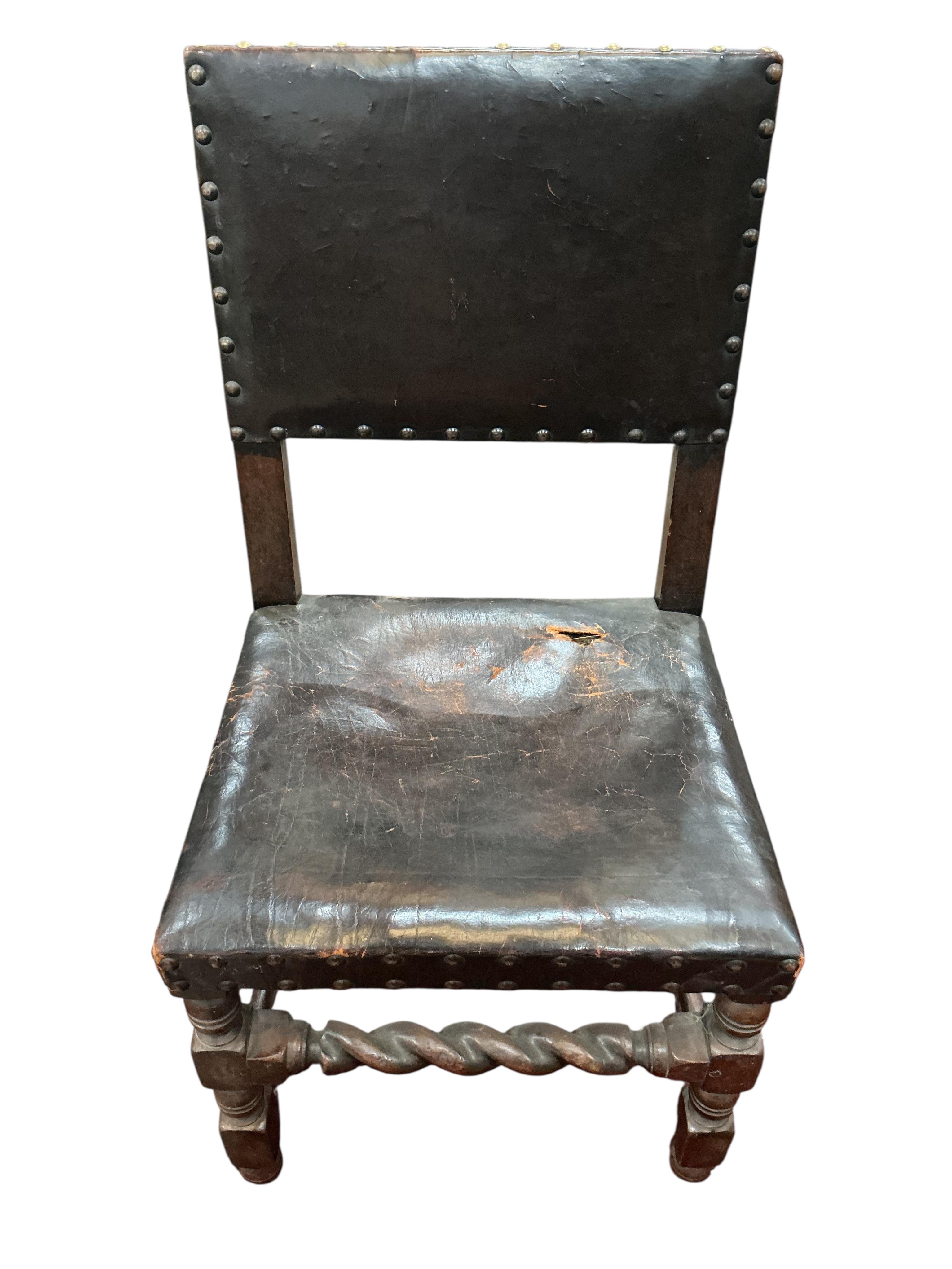 A set of eight Tudor style oak dining chairs, two with arms